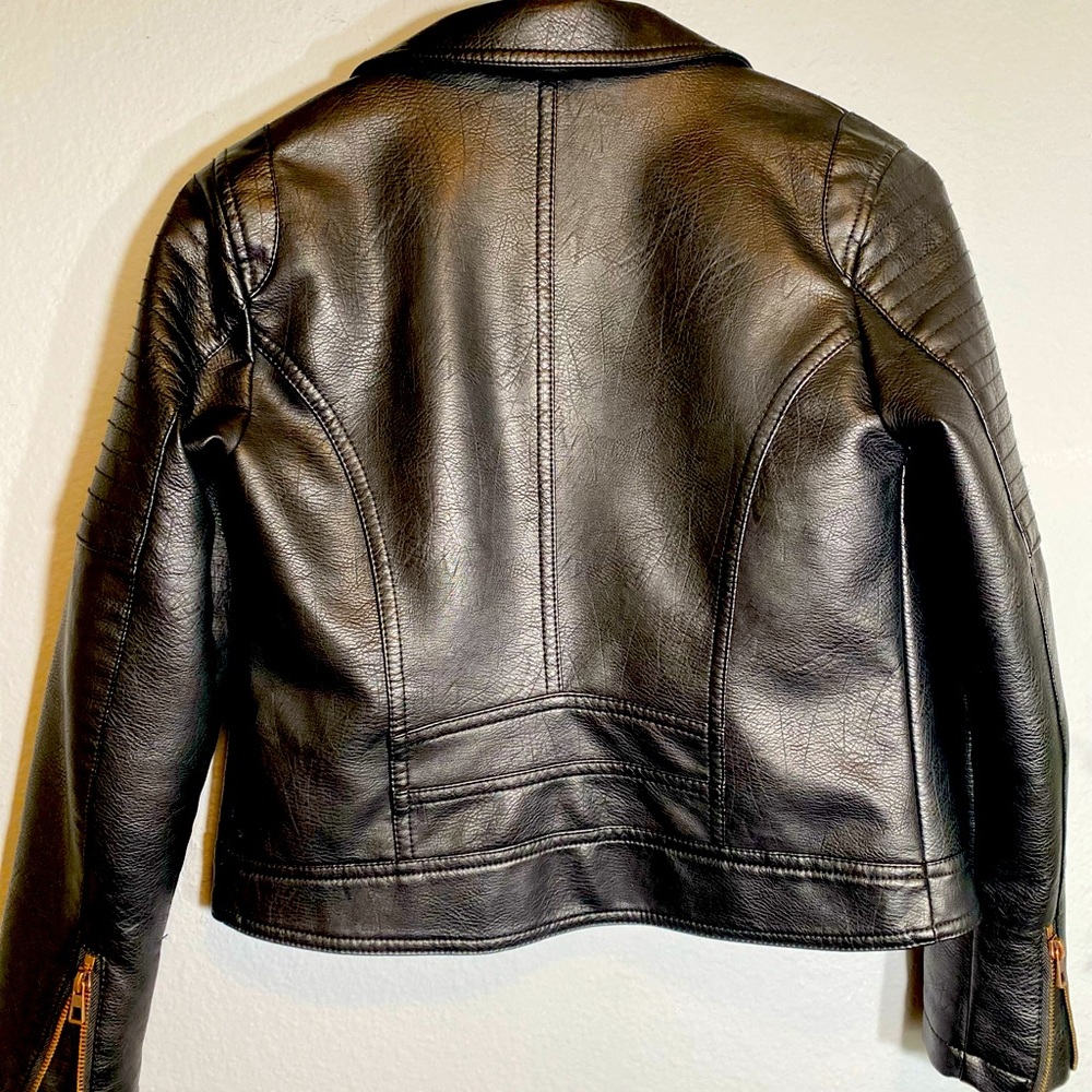 Black faux leather jacket, loos and feels real leather.